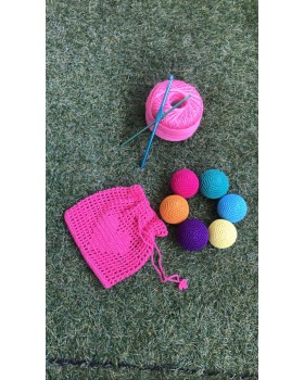 Baby playing rattle colouring balls.